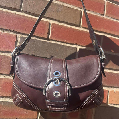 coach soho small leather buckle flap shoulder bag