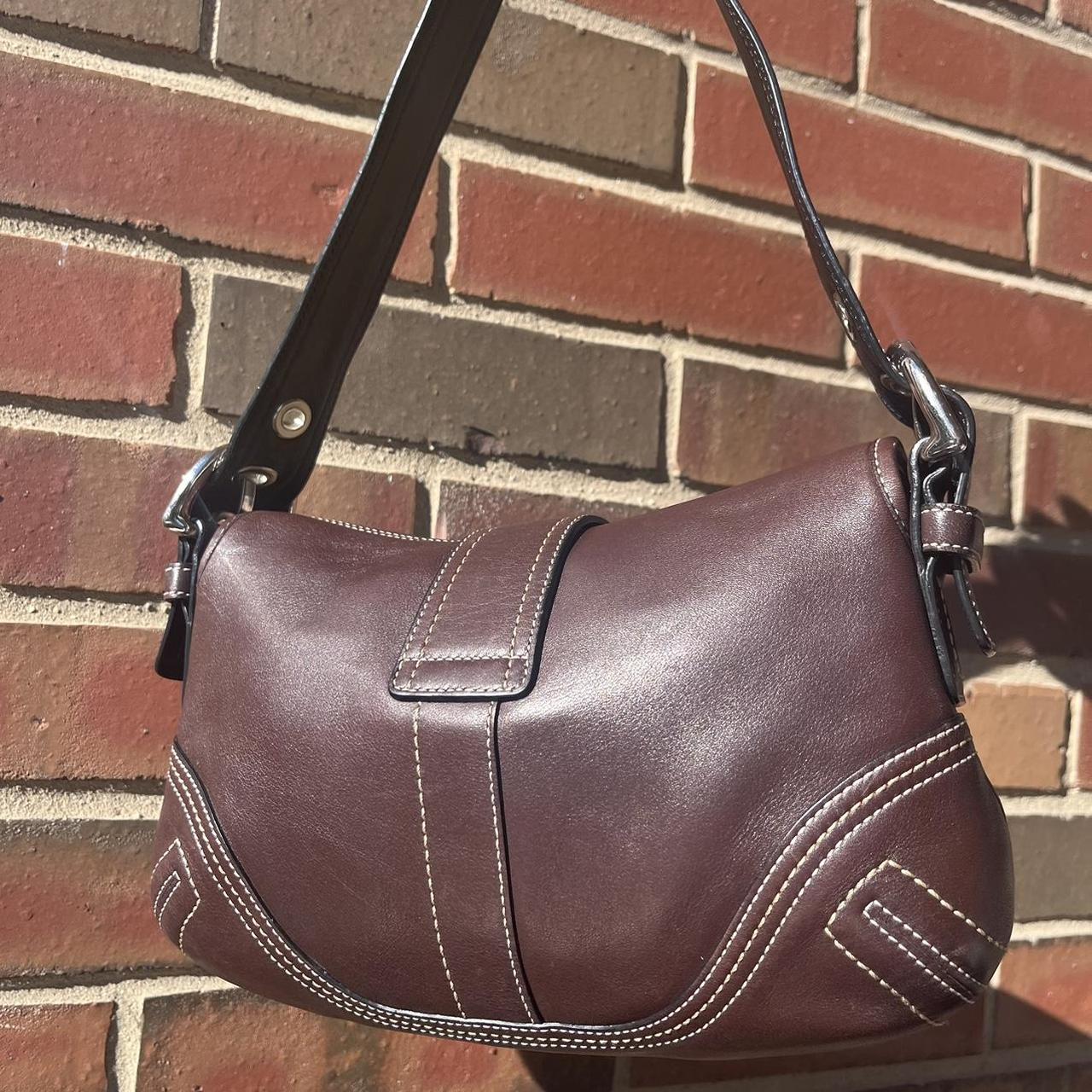 coach soho small leather buckle flap shoulder bag