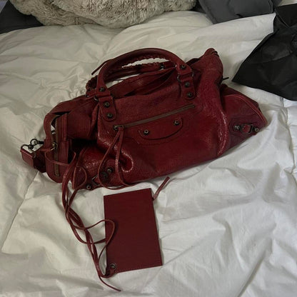 Balenciaga burgandy city baghandle strap